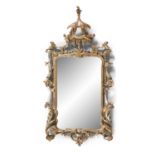 A PAIR OF IRISH GEORGE III GILTWOOD WALL MIRRORS, surmounted by open pediments, the shaped