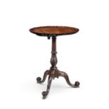 A FINE EARLY GEORGE III MAHOGANY TRIPOD TABLE, the pie crust tilt top on a flared and baluster