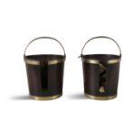 A PAIR OF MAHOGANY BRASS BOUND PLATE BUCKETS, of coopered construction, each with cut out slot and