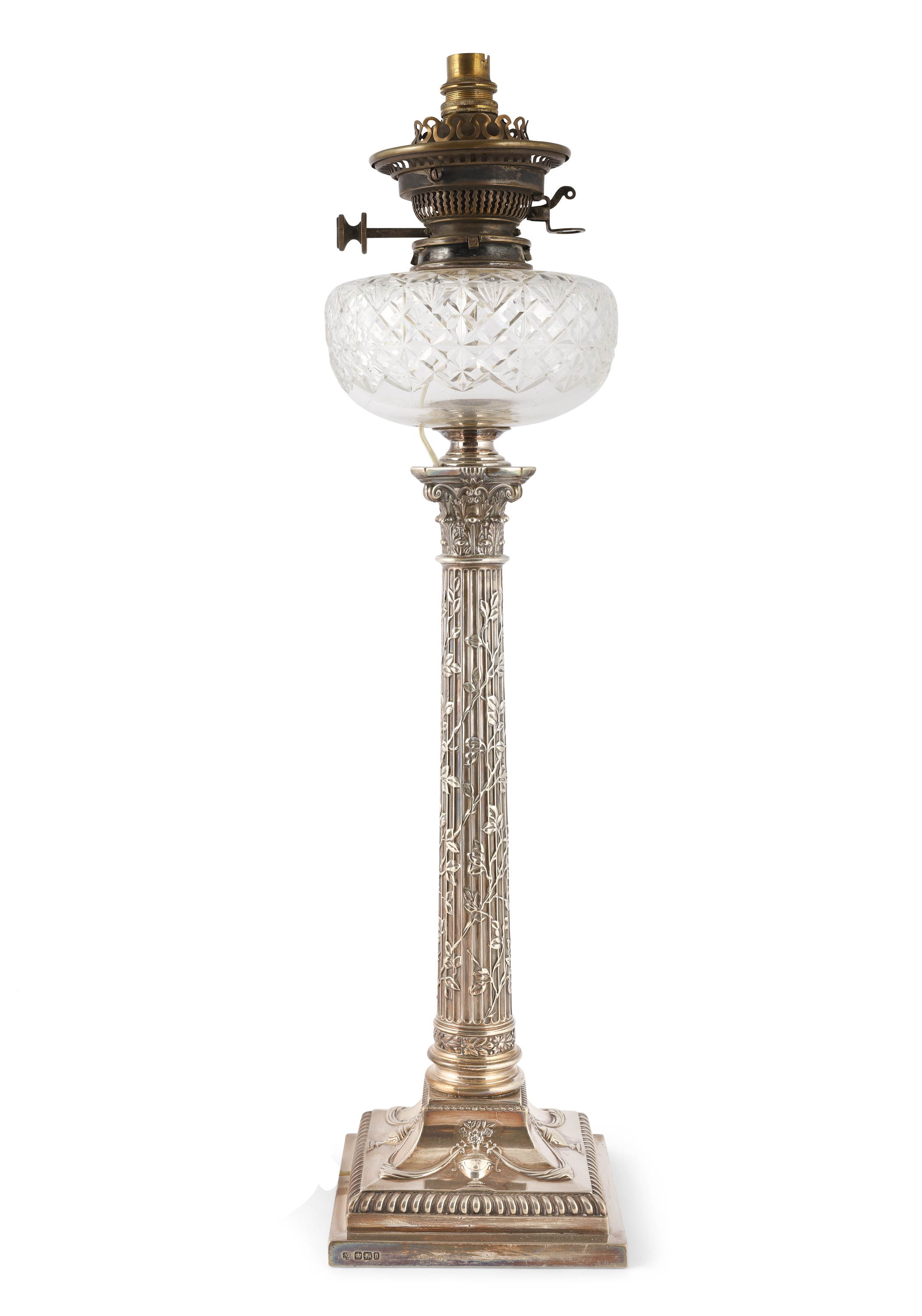 A TALL SILVER OIL LAMP, Sheffield 1924, in the form of an ivy wrapped Corinthian column, on a neo-