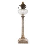 A TALL SILVER OIL LAMP, Sheffield 1924, in the form of an ivy wrapped Corinthian column, on a neo-