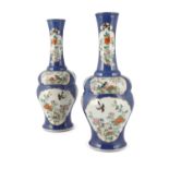 A PAIR OF CHINESE PORCELAIN POWDER BLUE GOURD VASES, Qing Dynasty, each with tall flared neck and