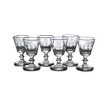 A SET OF SIX NAPOLEONIC WATER GLASSES, 19th century, with clear glass tapering bowls cut with a