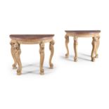 A PAIR OF REGENCY CARVED GILTWOOD CONSOLE TABLES, with red marble tops above a leaf moulded rim