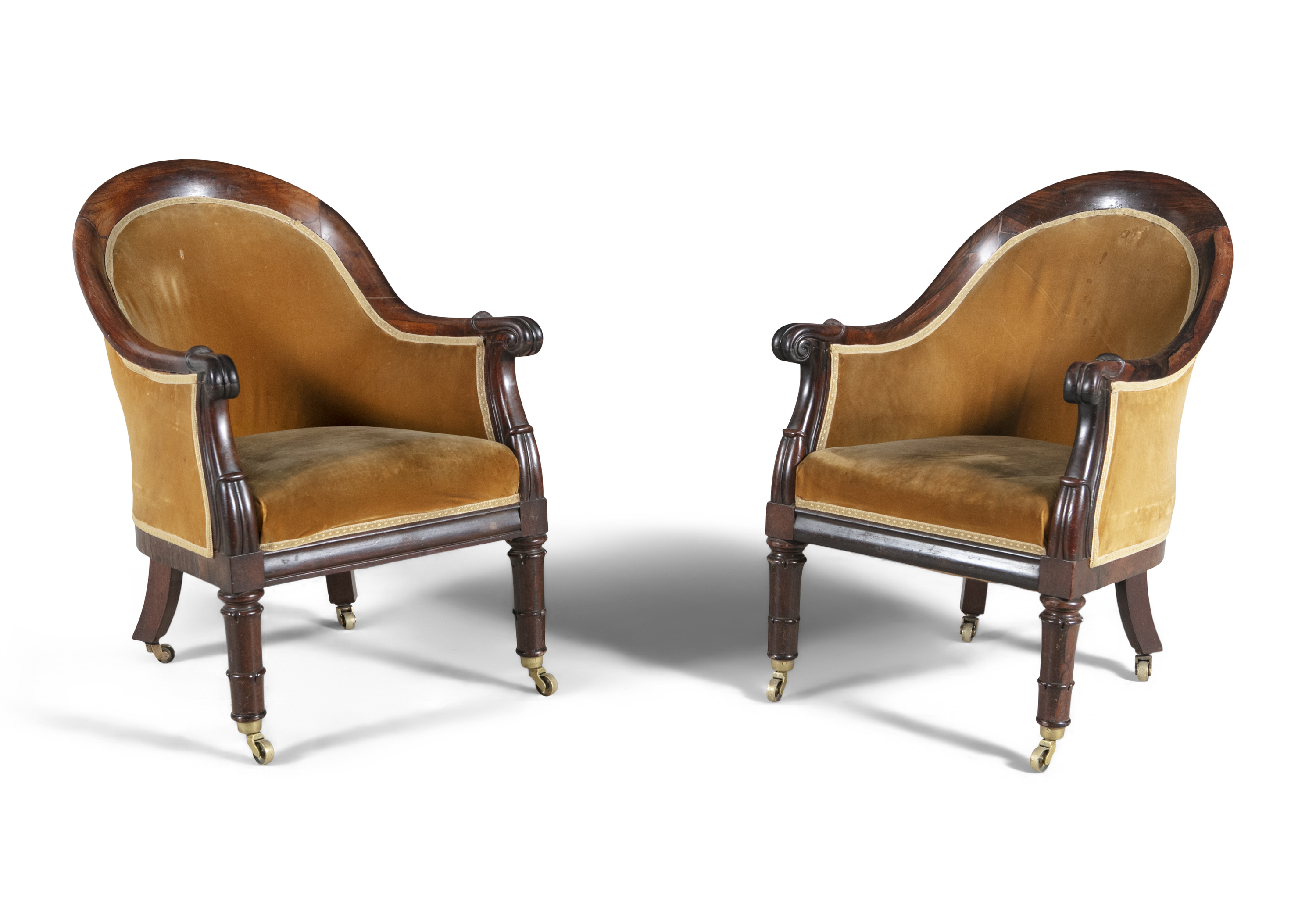 A PAIR OF IRISH WILLIAM IV MAHOGANY FRAMED UPHOLSTERED LIBRARY CHAIRS, with tub shaped backs covered