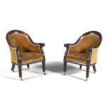 A PAIR OF IRISH WILLIAM IV MAHOGANY FRAMED UPHOLSTERED LIBRARY CHAIRS, with tub shaped backs covered