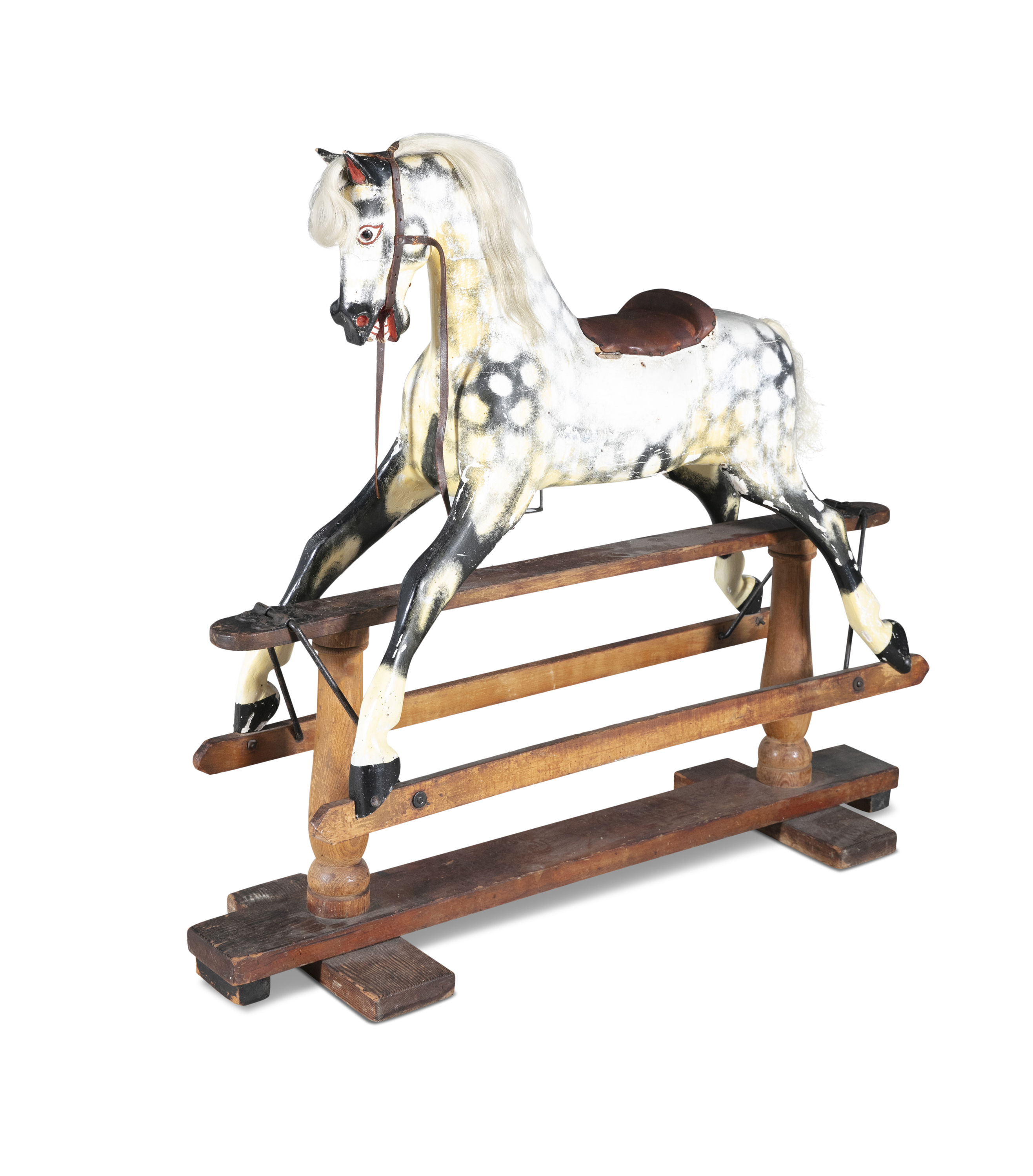 A 19TH CENTURY PAINTED TIMBER ROCKING HORSE, on a hinged swing support with pendulum movement. 128cm