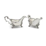 A PAIR OF IRISH GEORGE III SILVER HEAVY GAUGE SAUCE BOATS, by Thomas Jones, c.1780, the flared