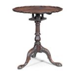 A FINE GEORGE III MAHOGANY TRIPOD TABLE, the pie-crust top above a birdcage action on a fluted,