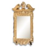 A GEORGE III STYLE GILTWOOD PIER MIRROR IN THE MANNER OF WILLIAM KENT, with broken architectural