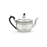 AN IRISH GEORGE III SILVER TEAPOT, by Gustavus Byrne, Dublin 1801, of oval baluster form, the hinged