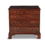 A COMPACT GEORGE III INLAID MAHOGANY RECTANGULAR CHEST, of two short and three long graduated