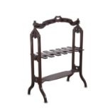 A VICTORIAN MAHOGANY BOOT AND WHIP RACK, the arched frame with pierced carrying handle, applied to