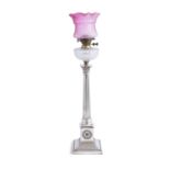 A LARGE SILVER PLATED RESERVOIR OIL LAMP WITH PINK GLASS SHADE, 19th century, of classical design,
