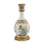 A CHINESE FAMILLE VERTE PEAR-SHAPED VASE WITH FRENCH BLUE COLLAR, the flared rim decorated with