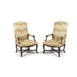 A PAIR OF 19TH CENTURY MAHOGANY FRAMED OPEN ARMCHAIRS, upholstered in yellow patterned fabric, the