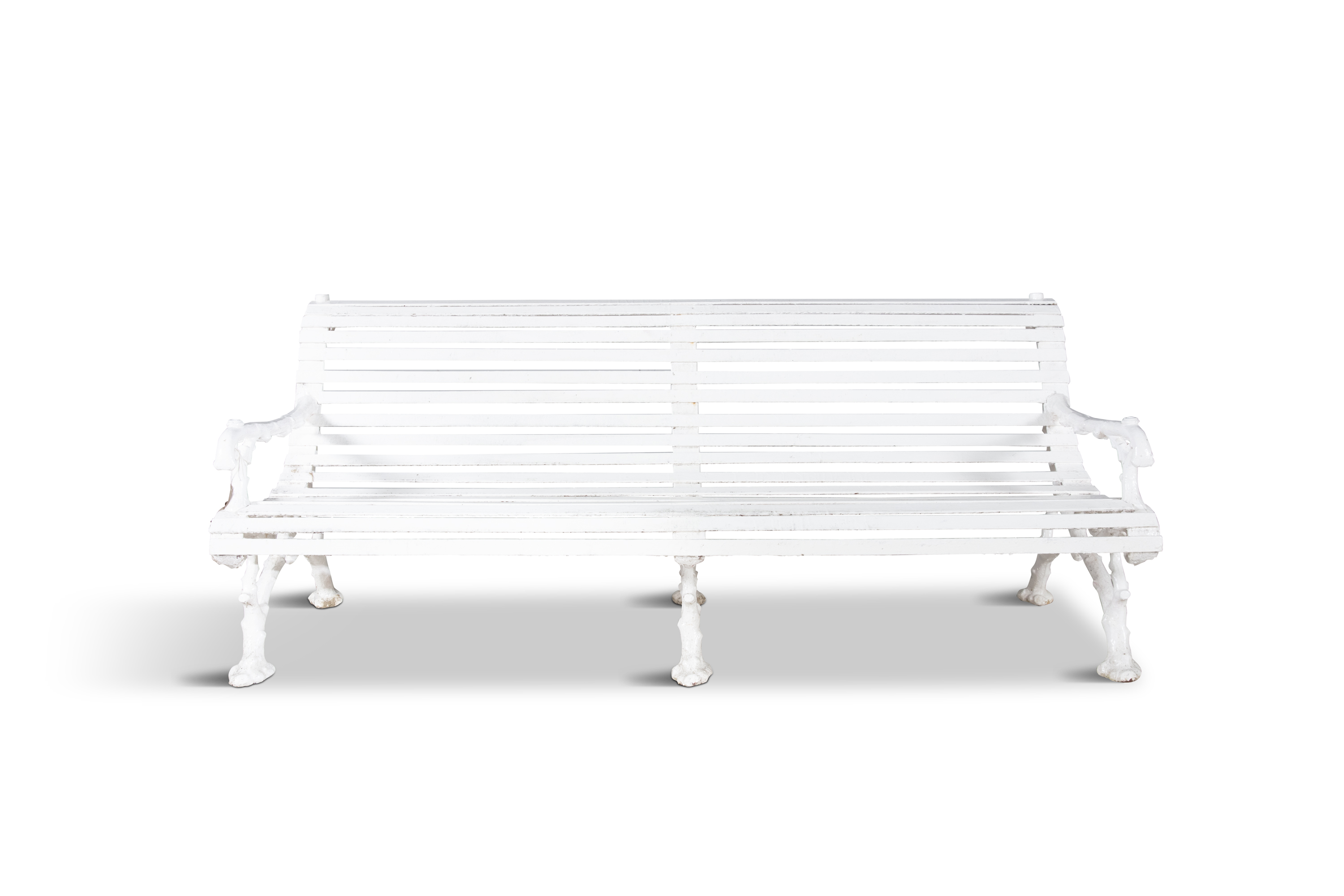 A VICTORIAN WHITE PAINTED CAST IRON SCROLL BACK GARDEN BENCH, supported on pierced naturalistic