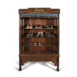AN EARLY 20TH CENTURY MAHOGANY SHOE DISPLAY CASE BY LIBERTY SHOES, of upright rectangular form,