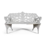 A VICTORIAN WHITE PAINTED 'FERN PATTERN' CAST IRON BENCH, the pierced back above wooden slats,