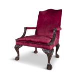 A GEORGE III STYLE MAHOGANY FRAMED GAINSBOROUGH ARMCHAIR, of generous proportions, with serpentine