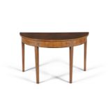 AN EDWARDIAN MAHOGANY AND BOXWOOD INLAID DEMI-LUNE SIDE TABLE, the shaped top decorated with