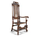 A CHARLES II WALNUT AND CANEWORK SIDECHAIR, c.1660, with arched canework back, surmounted by