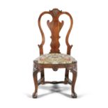 AN EARLY GEORGIAN WALNUT FRAMED SIDE CHAIR, with vase shaped splat crowned with a carved shell,