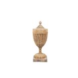 A GEORGE III NEO-CLASSICAL URN, the carved pine body surmounted with bud finial above a fluted