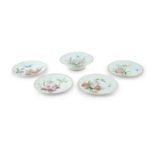 A SET OF FOUR WORCESTER DESSERT PLATES AND MATCHING COMPORT, the pale green ground decorated with