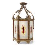 A 19TH CENTURY HEXAGONAL GILT METAL HALL LANTERN, filled with painted and gilded glass panels.