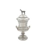 AN EDWARDIAN SILVER TWO HANDLED TROPHY CUP, London 1907, markers mark rubbed, the detachable top