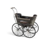 AN 19TH CENTURY CHILD'S PRAM, with boat shaped carriage, lined with button upholstery, turned timber