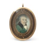 IRISH SCHOOL C.1790 Miniature portrait of a gentleman with green overcoat Oil on ivory, oval, 8.5