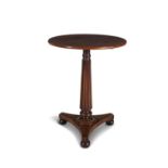 A LATE REGENCY MAHOGANY CIRCULAR OCCASIONAL TABLE, the plain top raised on reeded tapering centre