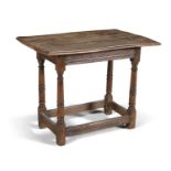 AN OAK TWO PLANK LOW TABLE, 17th century, the rectangular moulded top above a plain frieze with