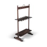 A 19TH CENTURY MAHOGANY BOOT RACK, with brass carrying handle, on turned side supports, with