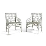 A PAIR OF VICTORIAN GOTHIC PATTERN CAST IRON GARDEN CHAIRS, each pierced with quatrefoils and gothic