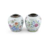 A NEAR PAIR OF CHINESE FAMILLE ROSE OVOID JARS, early 19th century, each with brown washed rim and