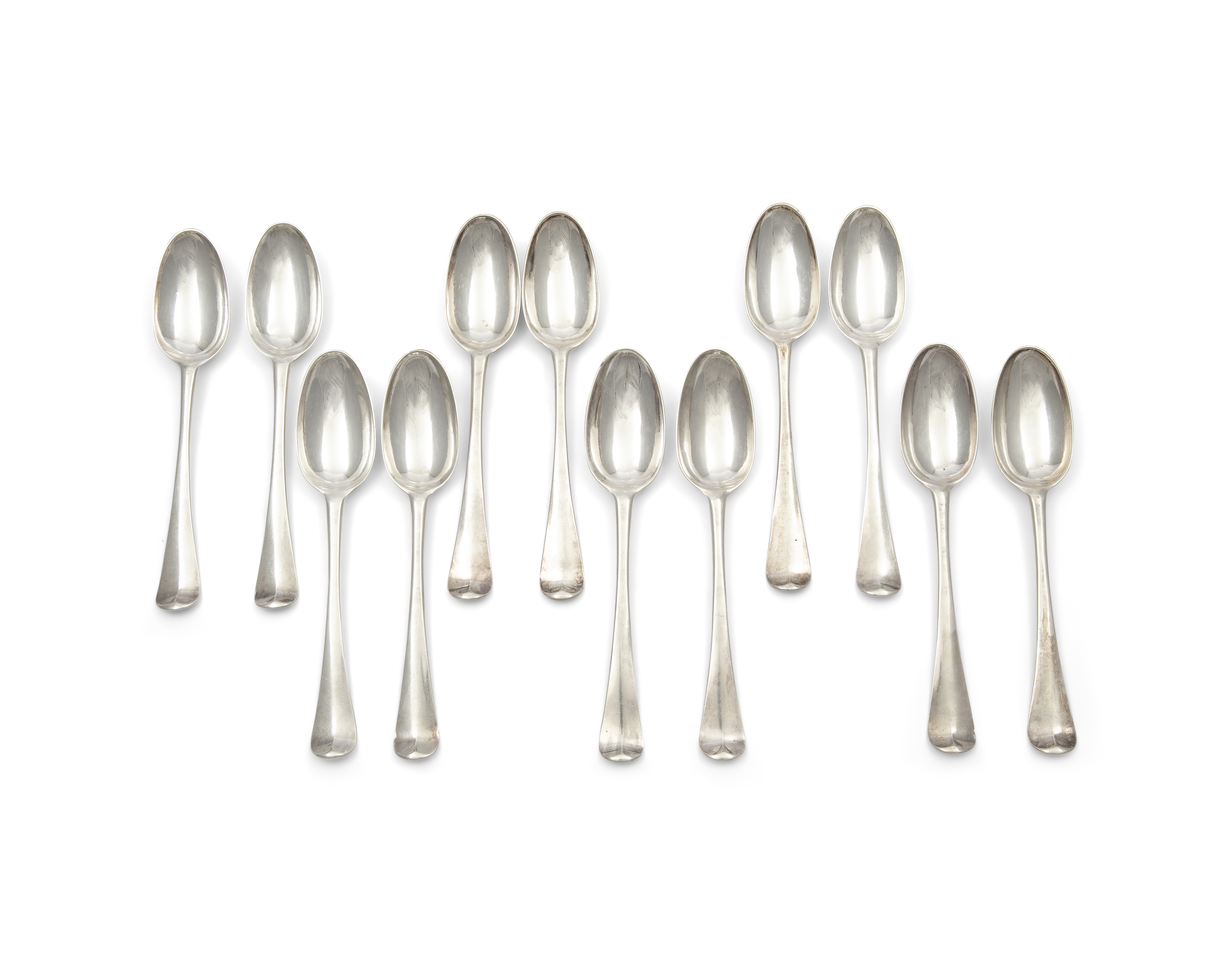 A FINE SET OF TWELVE IRISH GEORGE III SILVER HANOVARIAN PATTERN TABLE SPOONS, Dublin c.1761,