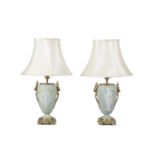 A pair of gilt brass mounted pate sur pate porcelain vases, c.1900, converted to table lamps, the