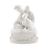 'Nymph & Faun' - A Royal Copenhagen blanc de chine porcelain group depicting Pan kissing a woman, on