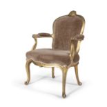 A French 19th century giltwood framed fauteuil, the moulded arch top with surmounted scroll,