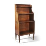 A Regency mahogany dwarf open bookcase, fitted three compartments of graduated form, with reeded