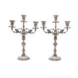 A pair of Irish silver cast table candelabra, mark of Royal Irish Ltd., Dublin 1971, with detachable