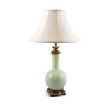 A Chinese celadon crackleware porcelain vase shaped table lamp, of baluster form, with cast brass