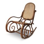 A Thonet style bentwood rocking chair, with arch panel back and seat with cane panelling. 92cm