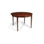 DINING TABLE A rosewood circular extending dining table with one leaf. Denmark c. 1960 73 x 110/ 160
