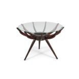 CARLO DI CARLI A 'spider' coffee table by Carlo di Carli, with a circular glass top. 49 x 72 x 72 cm