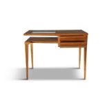 DESK A birdseye maple desk, with two drawers and a glass insert, Italy c.1950. 74 x 97 x 50cm