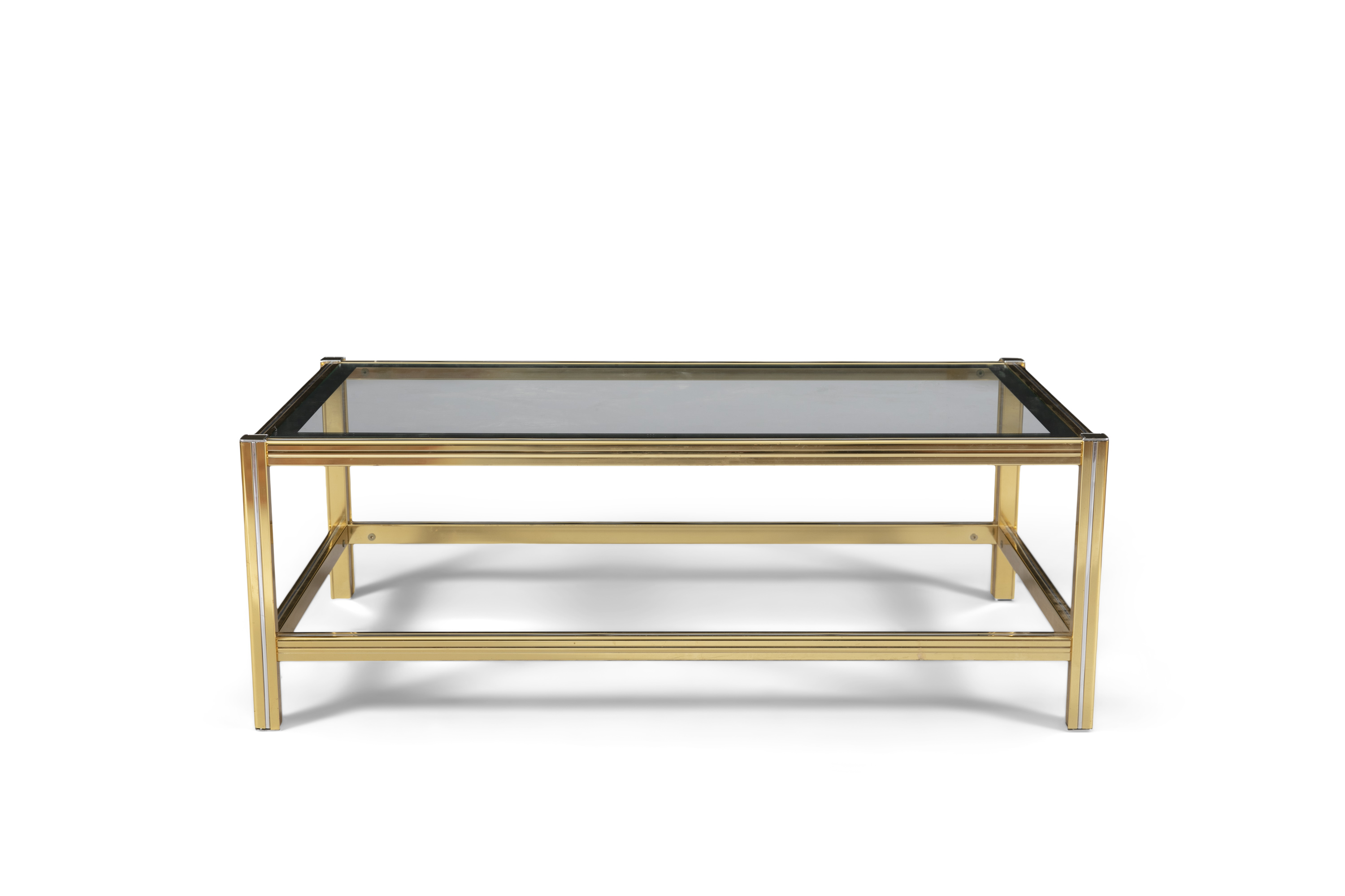 COFFEE TABLE A two tier glass topped coffee table with a brass and chrome base. c. 1960. Italy. 39 x